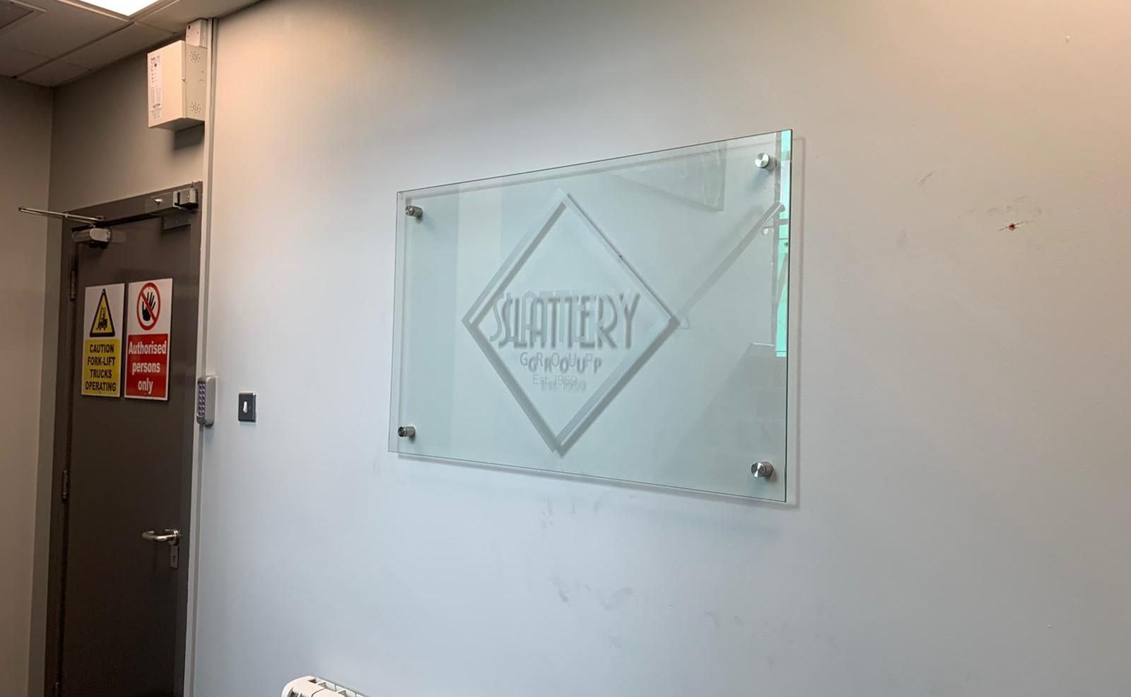 Internal perspex wall sign for the Slattery Groups